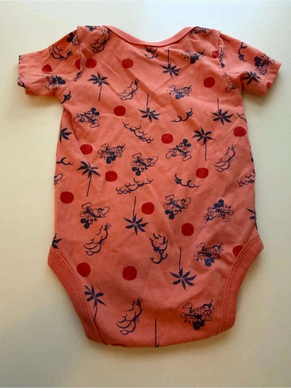 Junk Food Clothing Coral Pink Bodysuit with Navy Character Print